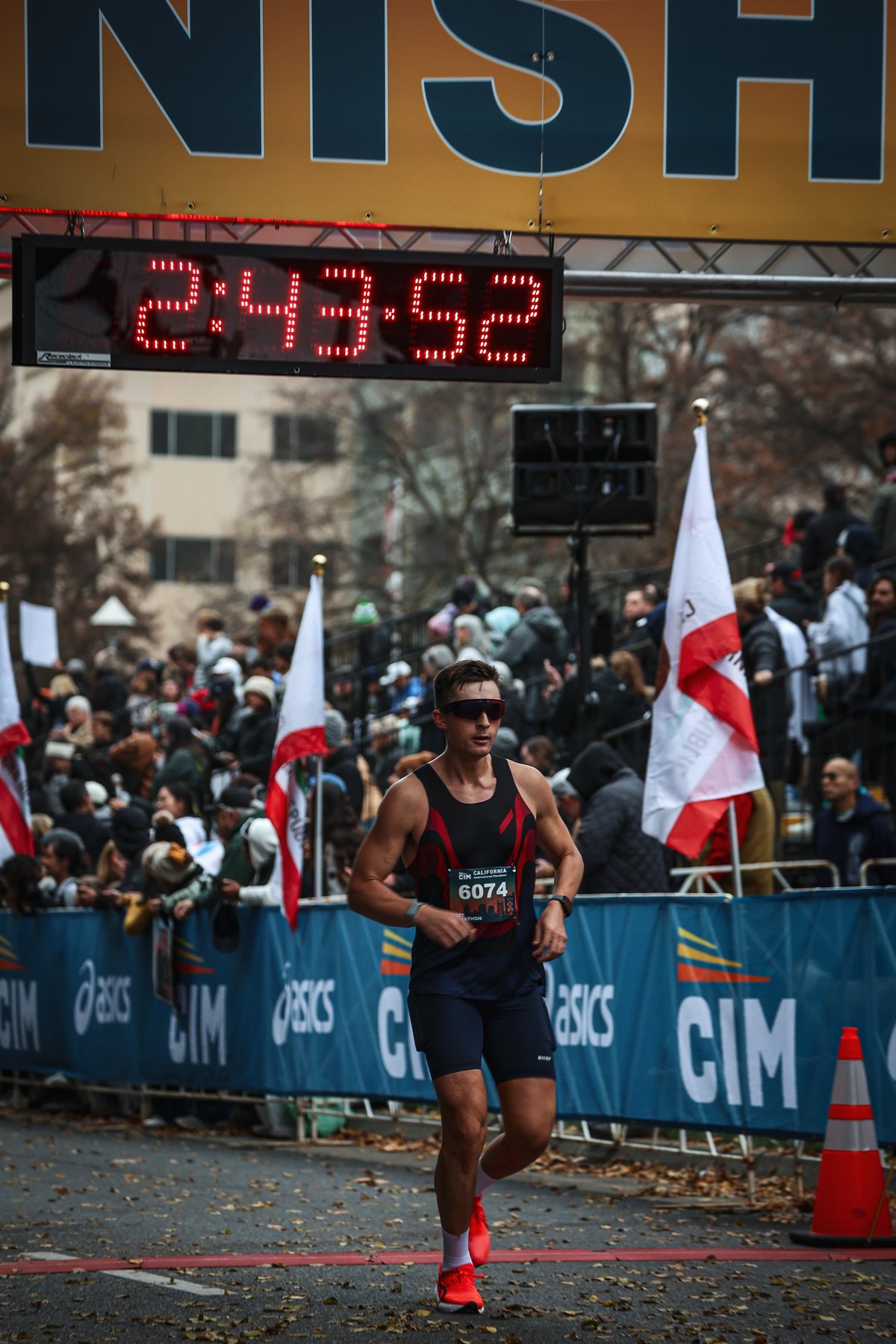 Hank McGreen crossing the CIM finish line